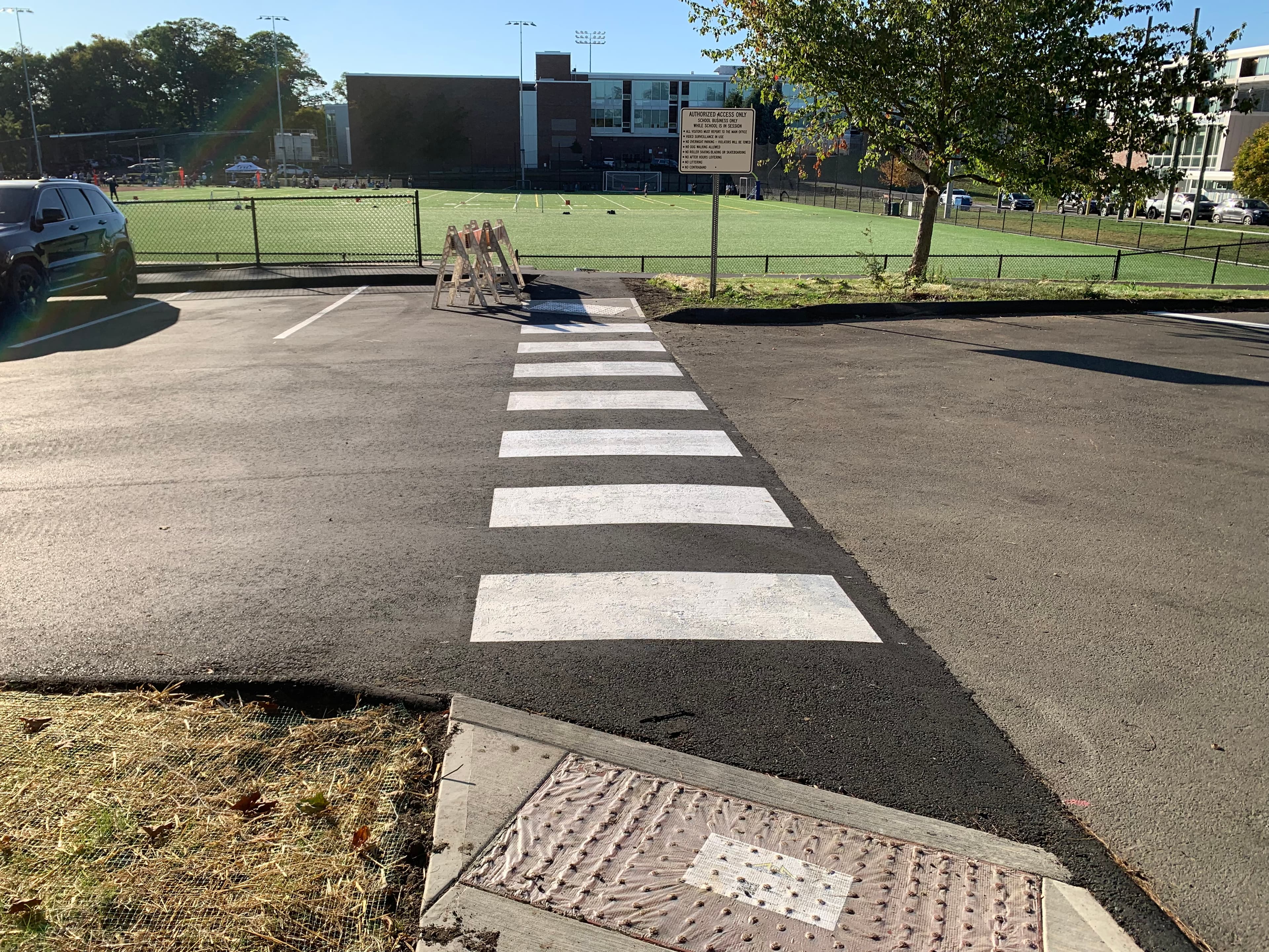 White crosswalk with stop bars at Fairfield CT municipal parking lot