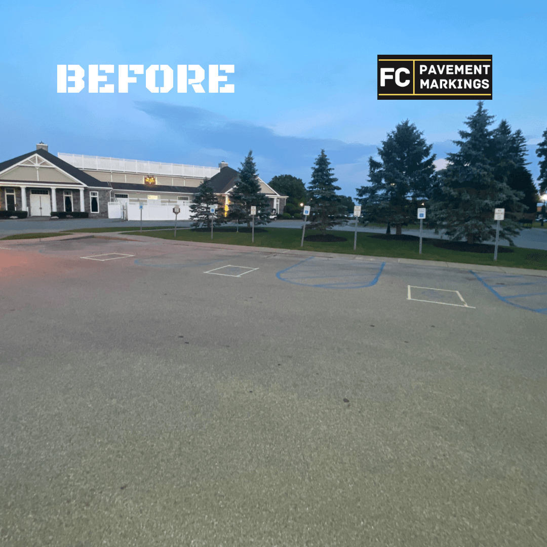 ADA handicap parking stalls before restriping with faded stencils