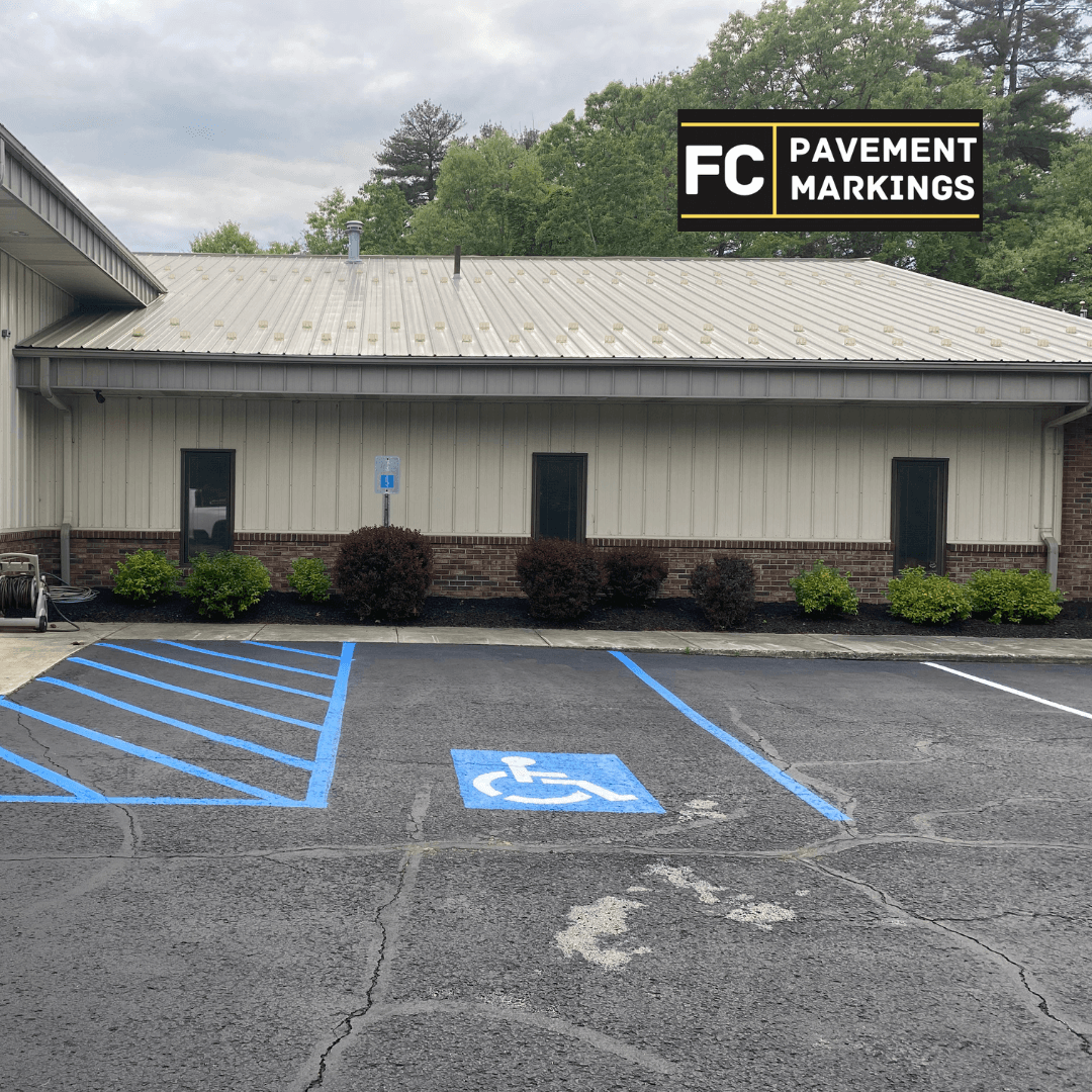 ADA accessible parking stall with fresh stencils at Clifton Park NY commercial lot