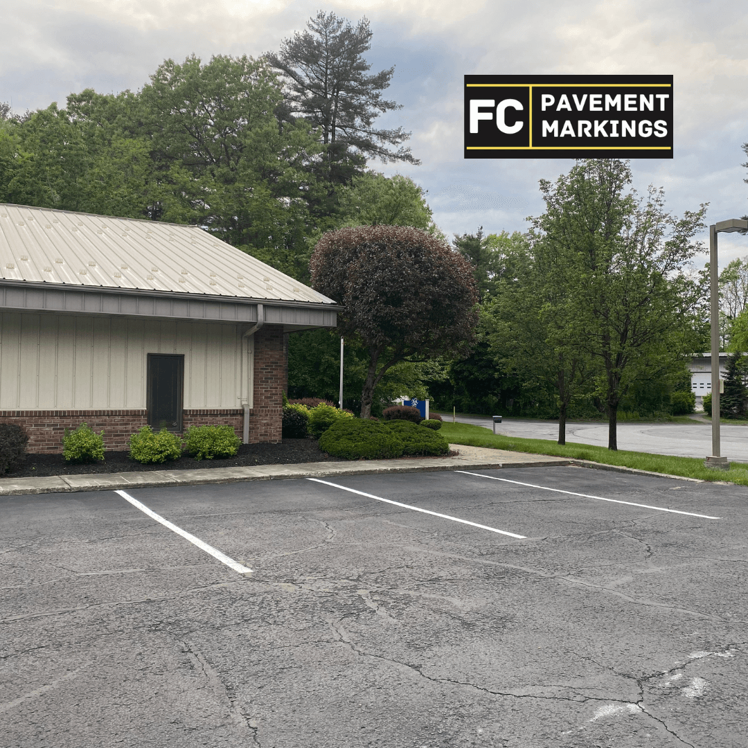 Commercial parking lot restriped with fresh white lines and sharp ADA stencils Commercial parking lot restriped with fresh white lines and sharp ADA stencils